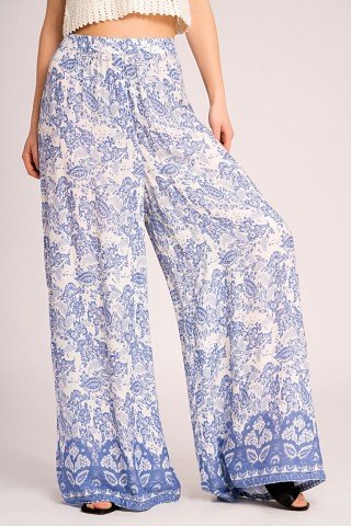 Pantaloni largi albi cu imprimeu bleu