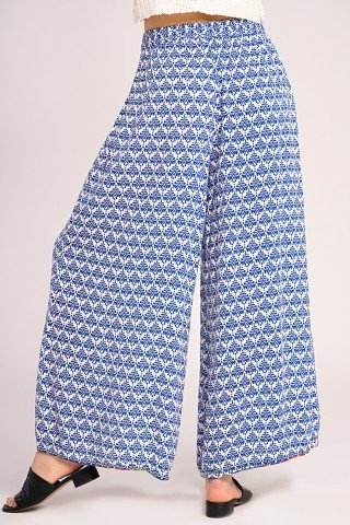 Pantaloni lungi largi albi cu print albastru