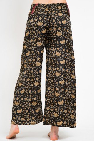 Pantaloni petrecuti negri cu print floral crem