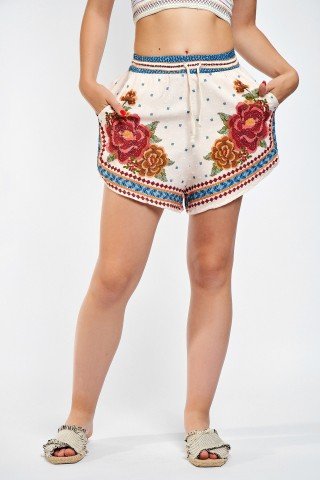 Pantaloni crem cu print floral caramiziu